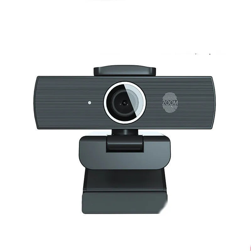 Black USB webcam with magnetic privacy cover on a desk, showing 1.7m cable.
