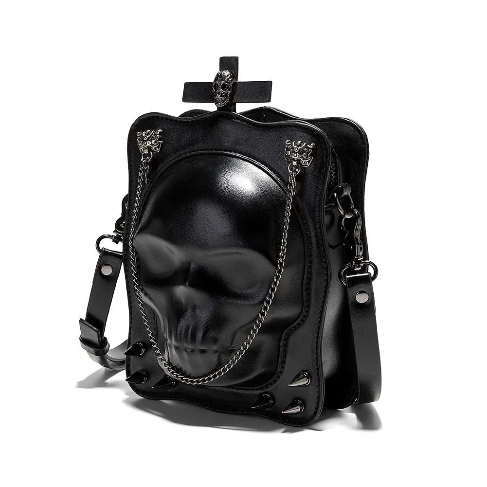 Black mini square crossbody bag with 3D embossed skull design, stitching, and chain detailing