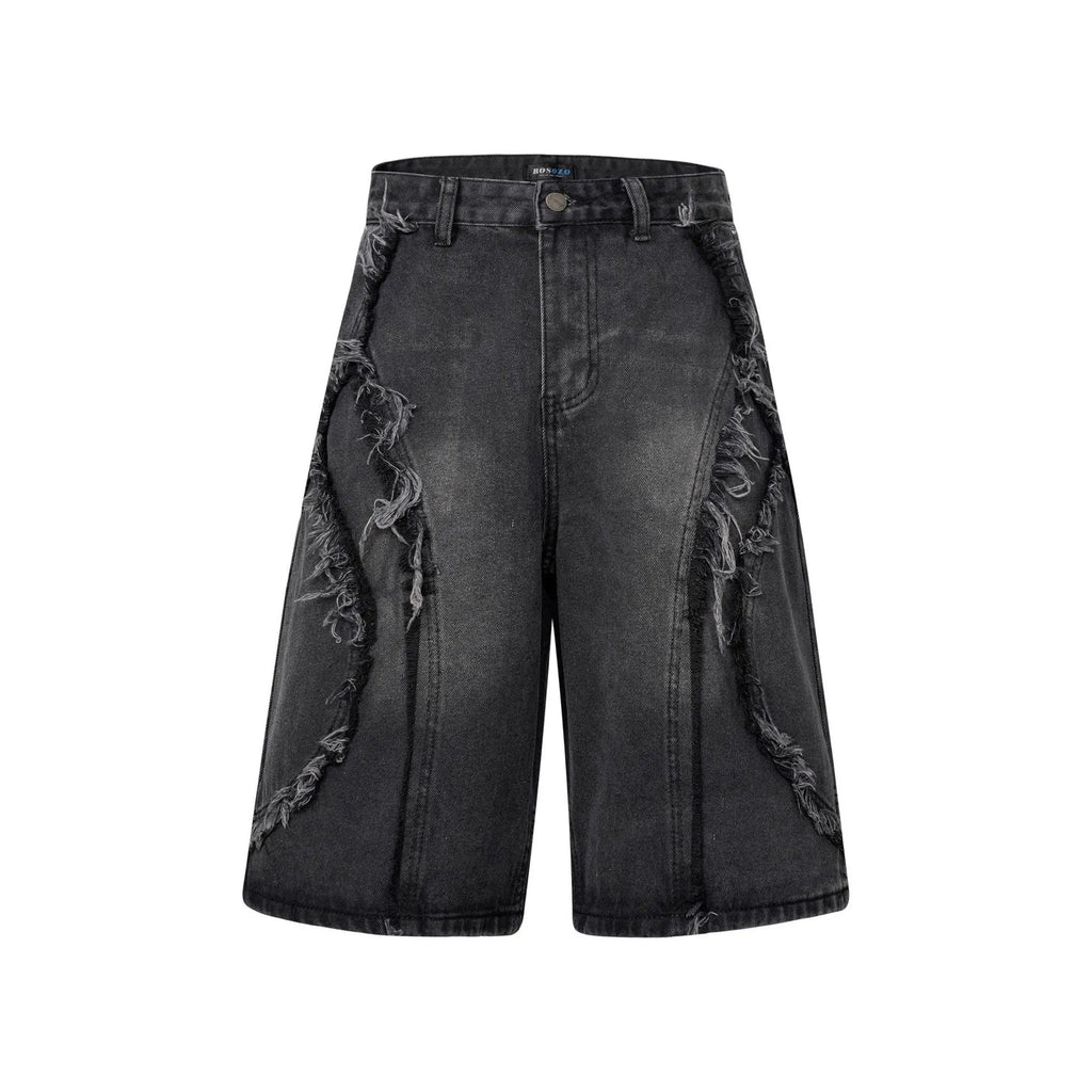 American Pu Shuai distressed raw edge denim shorts in straight leg cropped fit on a grey background.
