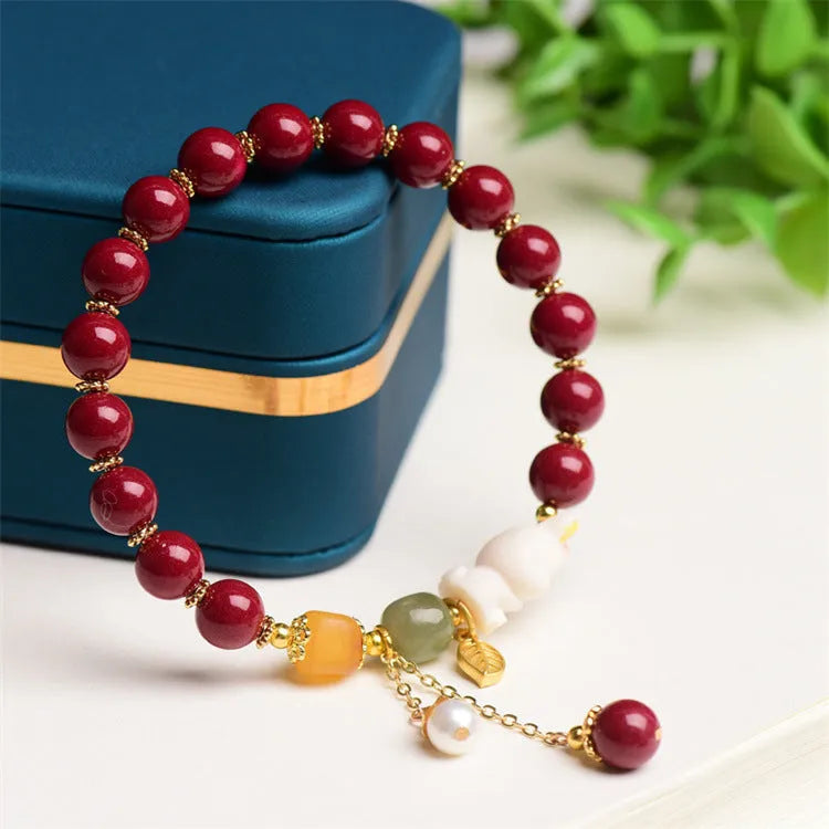 Natural cinnabar rabbit bracelet in national style design showing 8mm and 10mm size options