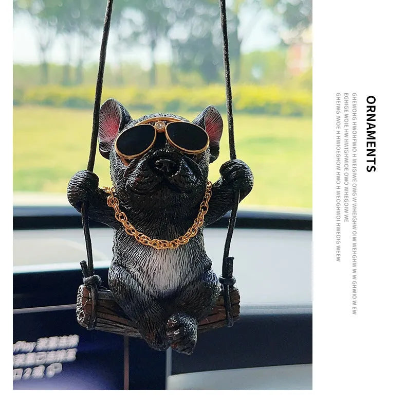 Cartoon-style resin bulldog car pendant hanging from a rearview mirror.