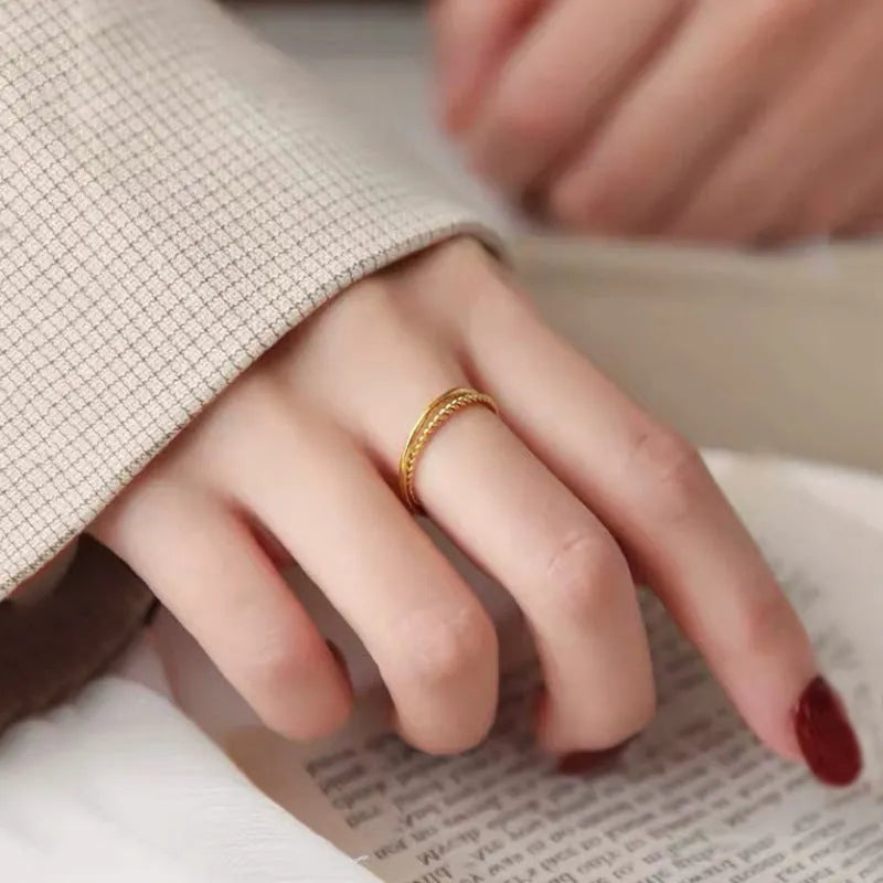 Brass gold plated women's ring in simple bracelet and twist styles, shown in UK sizes 6 to 9.