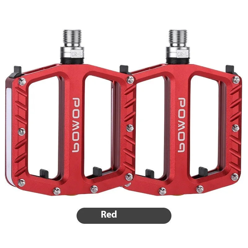 Aluminium alloy bicycle pedals with built-in 710LED lights in black, gold, purple, red, and titanium colour options.