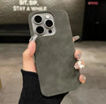 Solid colour imitation suede shockproof iPhone case with frosted finish on a table.