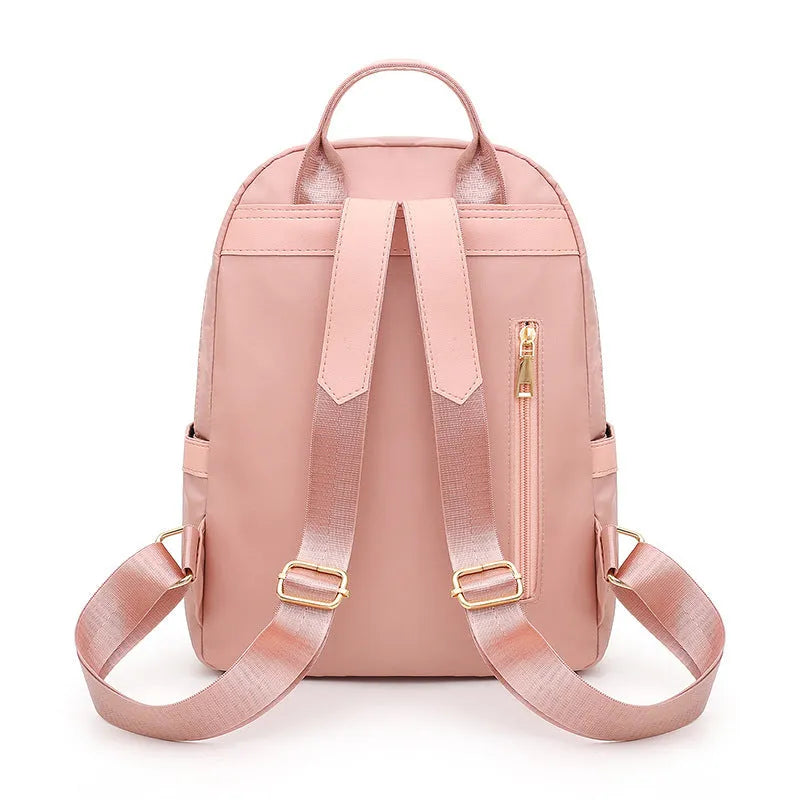 Women's black nylon casual backpack with double shoulder straps and front pocket