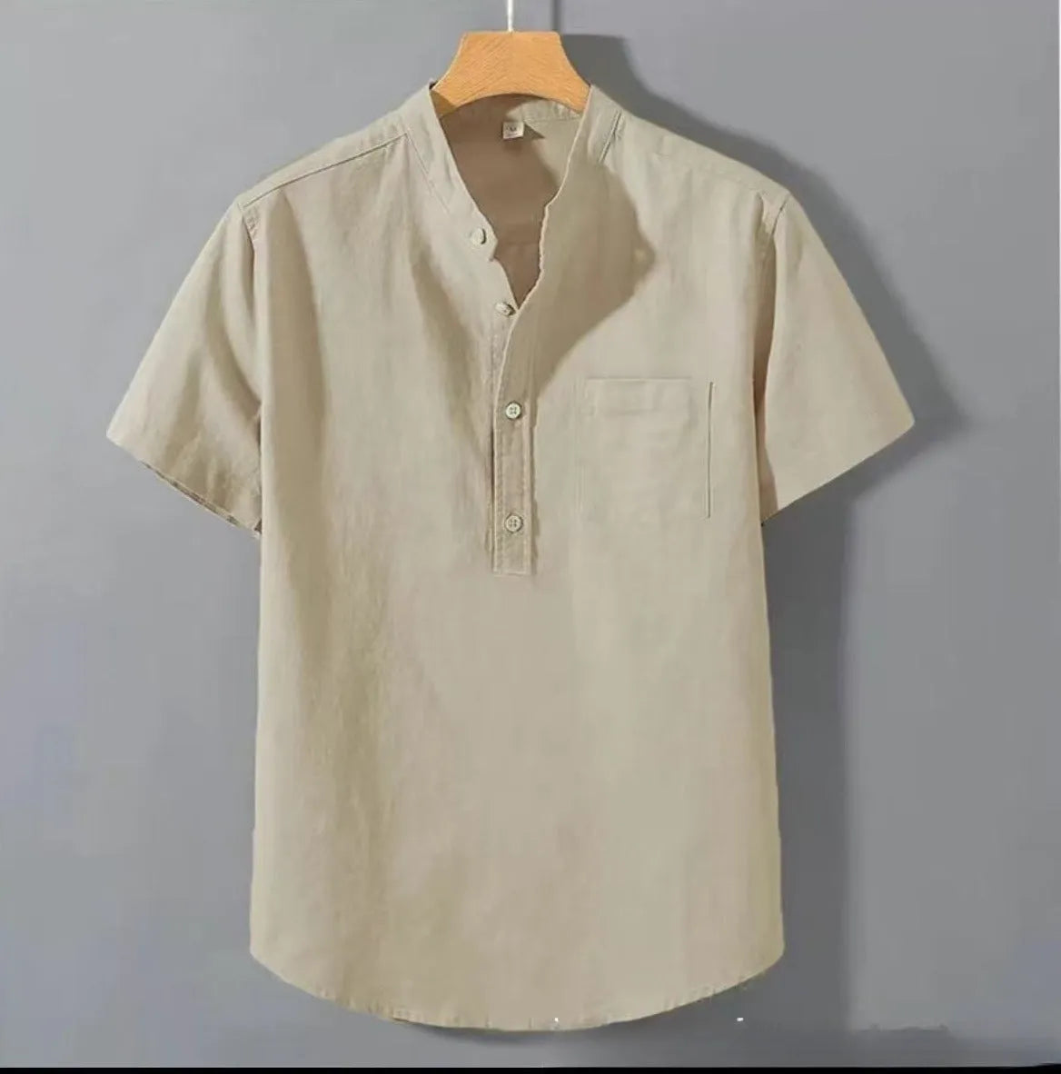 Men's beige loose-fit linen casual shirt with a stand collar and short sleeves on a hanger.