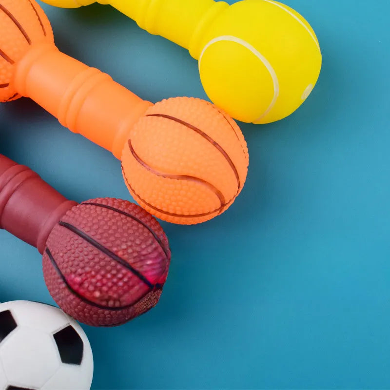 Non-toxic PVC squeaky dog chew toy shaped like a football and dumbbell in assorted colours.