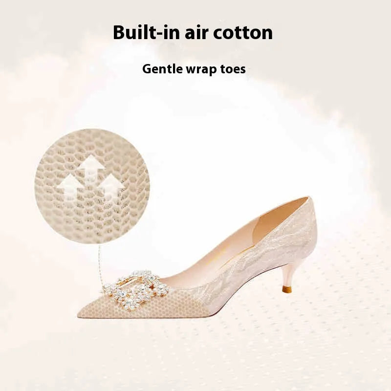 Champagne gold women's high heel pumps with pointed toe, stiletto heel, and rhinestone decoration.
