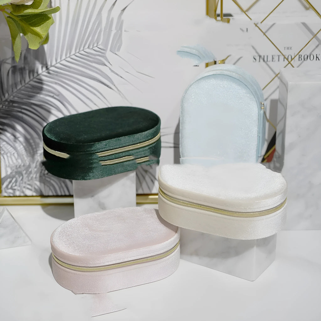 Oval velvet jewellery storage box with flannel interior in multiple colour choices.