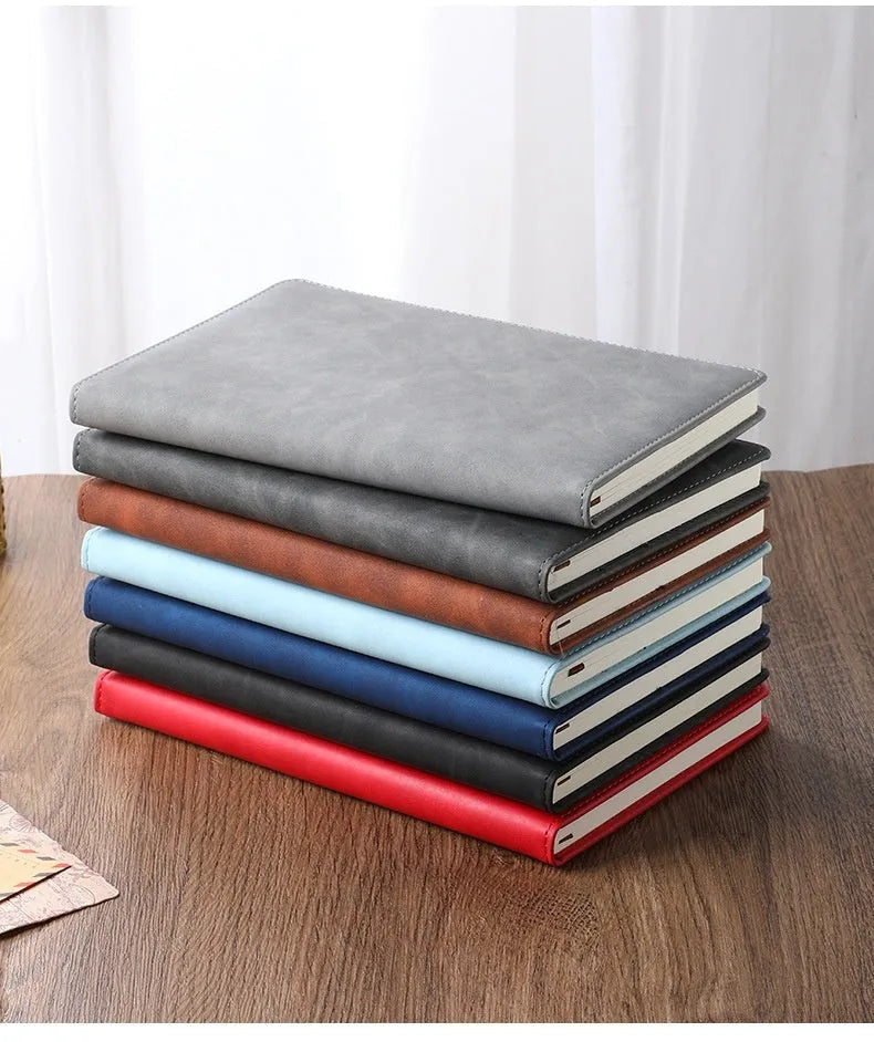 Custom A5 notebook with PU leather cover in multiple colour options showing wood-free paper pages