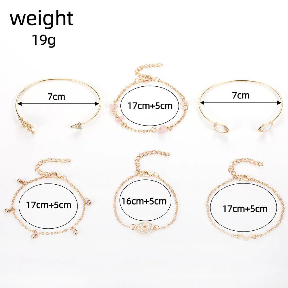 Gold zinc alloy bracelet set with six pieces showing arrow and water drop charms