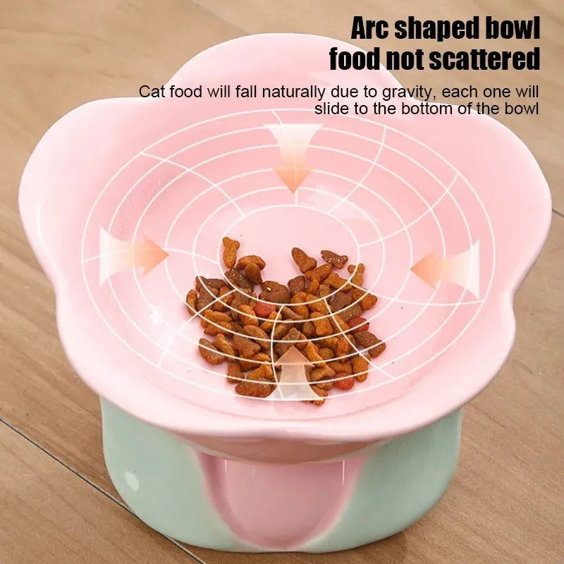 Blue ceramic elevated pet bowl with floral pattern and non-slip base for cat or small dog