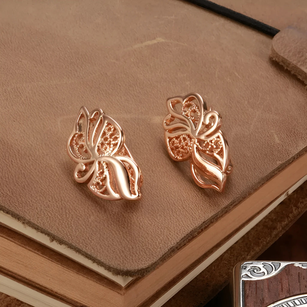 Rose gold copper earrings with hollow carved geometric design and rhinestone accents for women