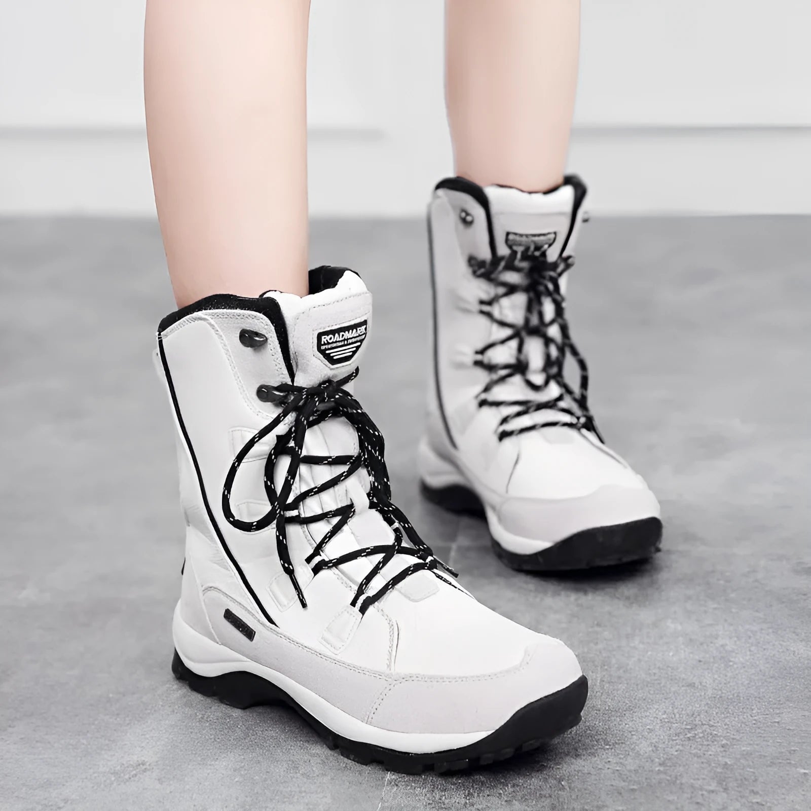 Women's mid-calf length thermal snow boots in genuine leather with round toe design