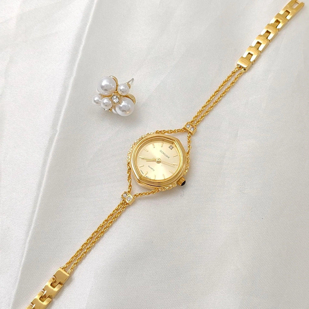 Gold or silver Mori-style women's quartz watch with a 25mm dial and metal chain strap.
