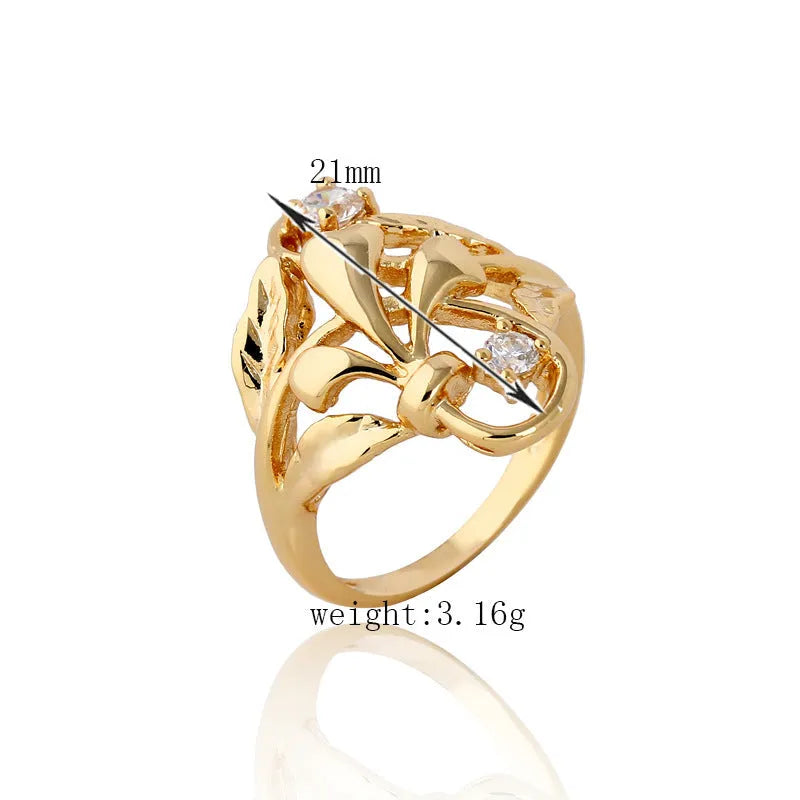 Gold tone copper ring with irregular leaf shape and white zircon crystal on geometric band, women's fashion jewellery