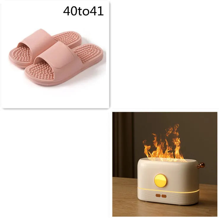 Black desktop humidifier with flame effect light and mist output, showing USB port and water tank.