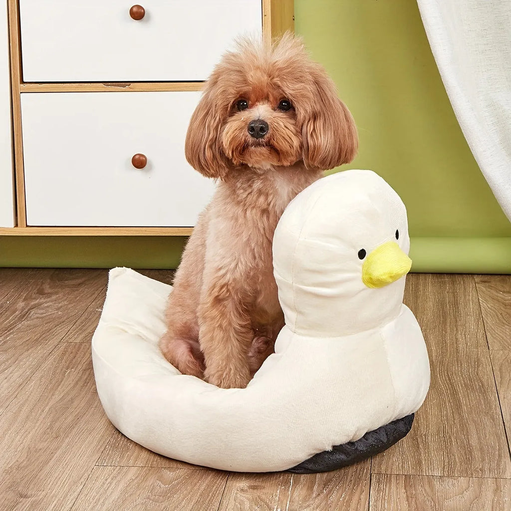 Blue duck-shaped soft polyester pet bed sofa for small dogs and cats on a wooden floor.