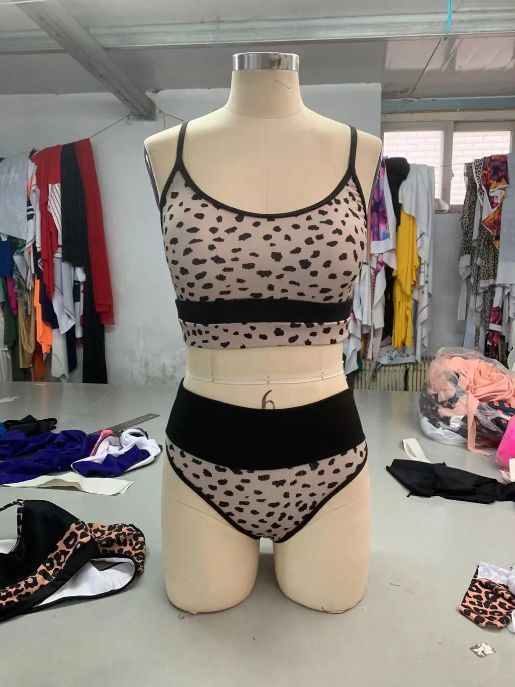 Women's high waist split bikini swimsuit in leopard print or white colours with adjustable ties