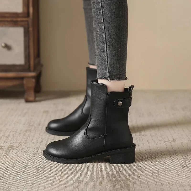 Black women's low heel boots with side zip and round toe on a white background.