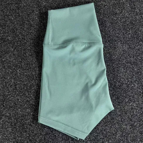 Women's high-waist nylon yoga shorts in various colours for moisture-wicking during exercise