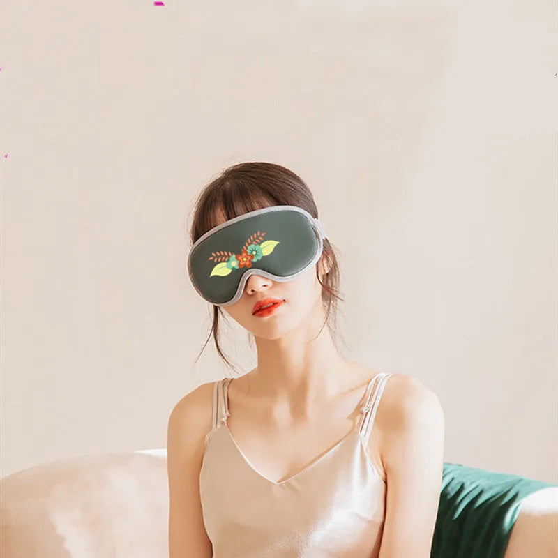 Pink and green portable eye massage goggles with steam and heating functions