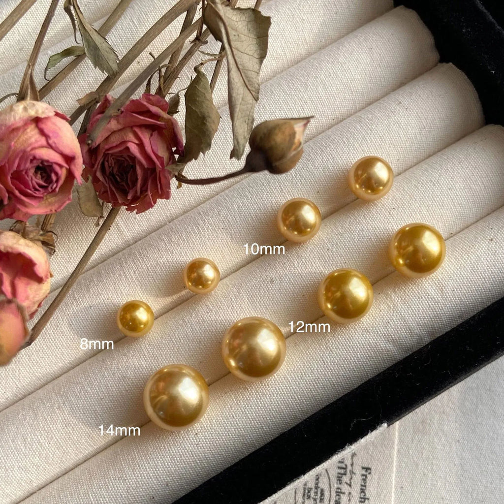 Retro-style geometric pearl stud earrings with star charms on silver settings