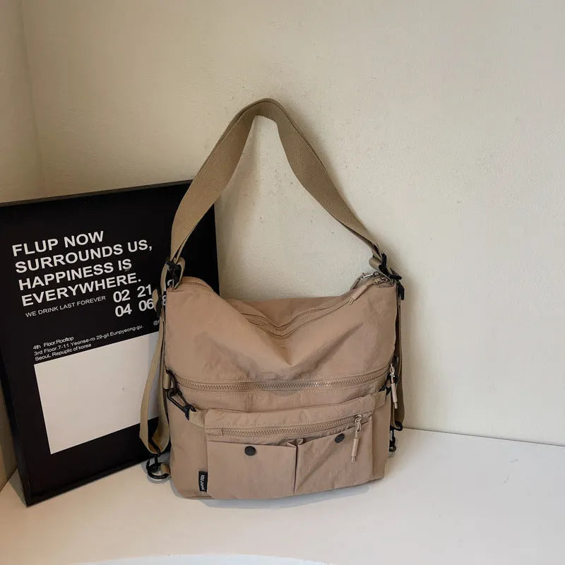 Women's nylon crossbody bag with adjustable strap and external pocket in khaki colour