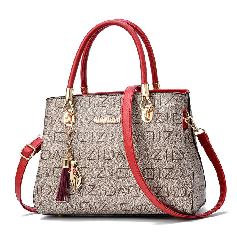 Printed PU ladies handbag with zip closure, horizontal square shape and single shoulder strap in khaki print.
