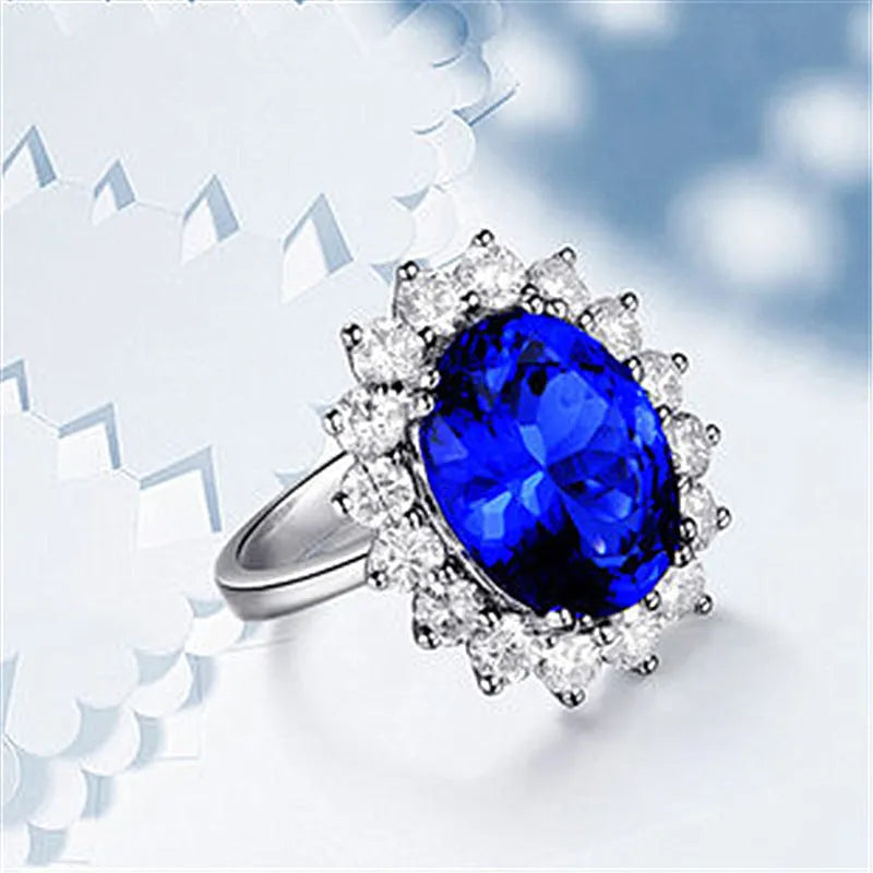 Adjustable opening rhinestone ring in platinum colour with geometric design on white background