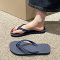 PVC toe-covering flip flops for men on a plain background showing colours and injection-moulded sole.