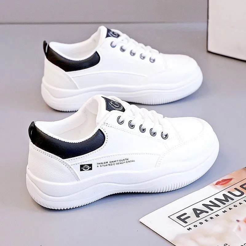 Women's white Korean-style leather pumps with cross straps and a 3-5cm mid heel on a rubber sole.