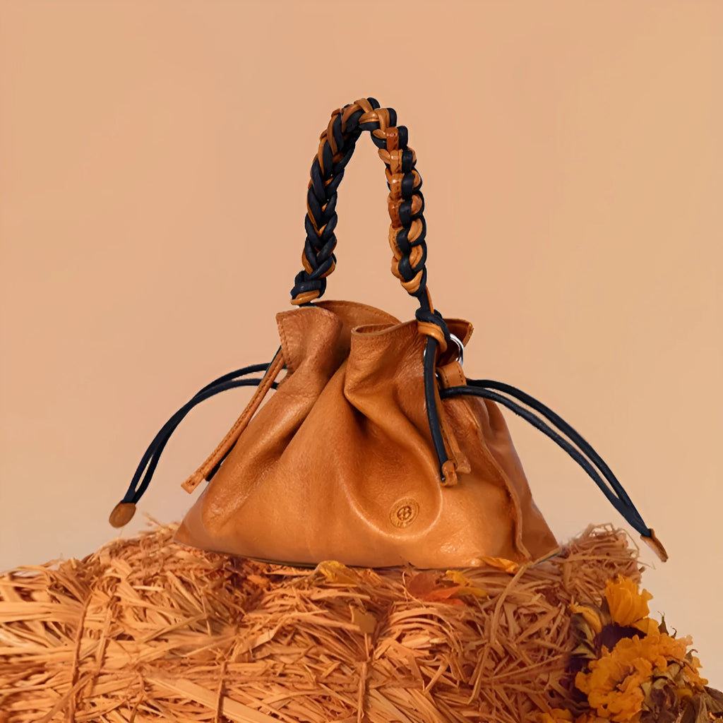 Women's cortex splicing woven leather crossbody bag in orange colour with top grain leather finish and zipper closure