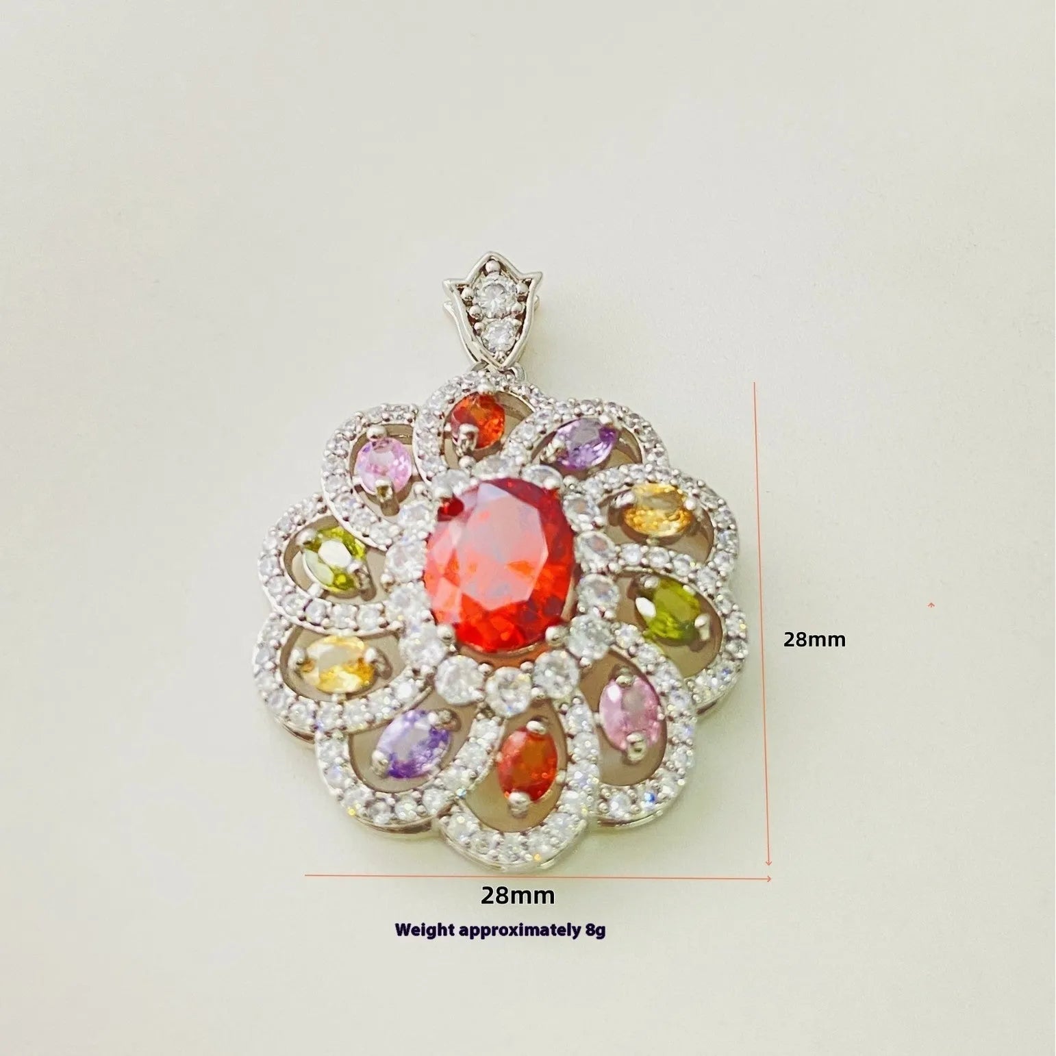 Close-up of a colourful zircon flower pendant necklace in a gold finish, showing floral detail.