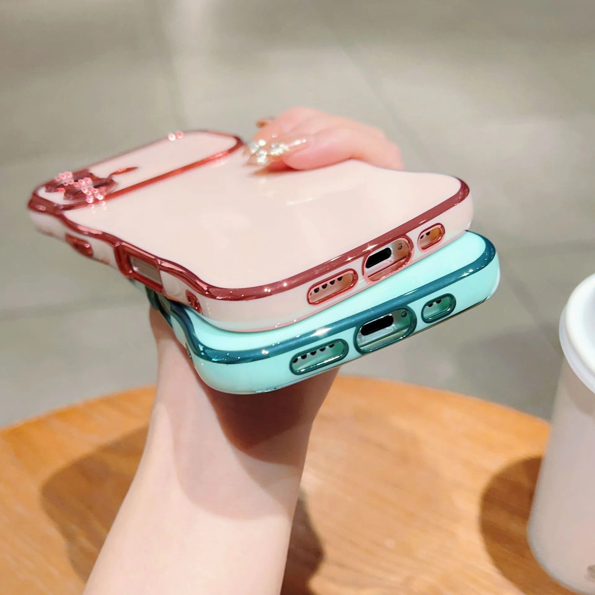 TPU phone case with electroplated wave design and large window, black colour, positioned to show reflective surface