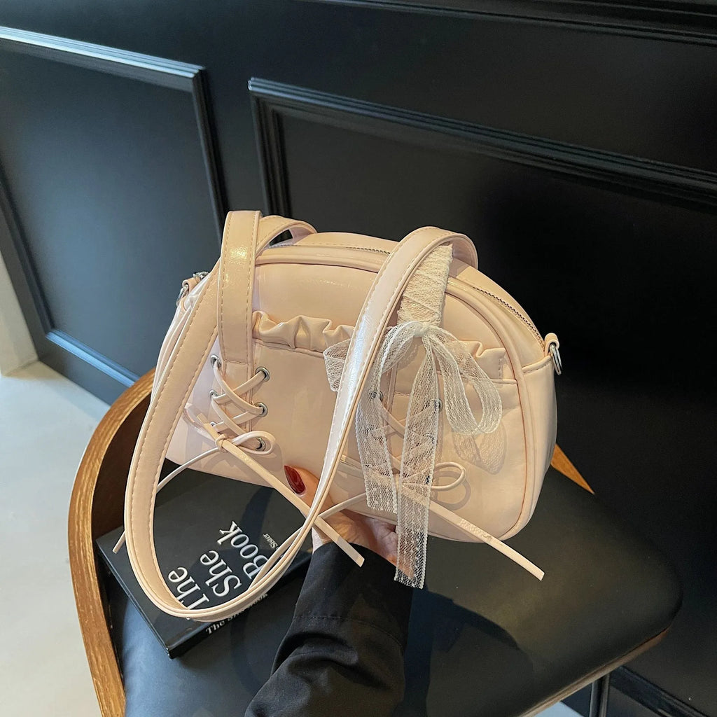 Casual ladies shoulder handbag with bandage bow detail in PU material showing mobile phone compartment