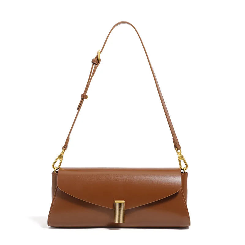 Milky white cowhide leather women's cross-body bag with pillow shape and cross-body strap.