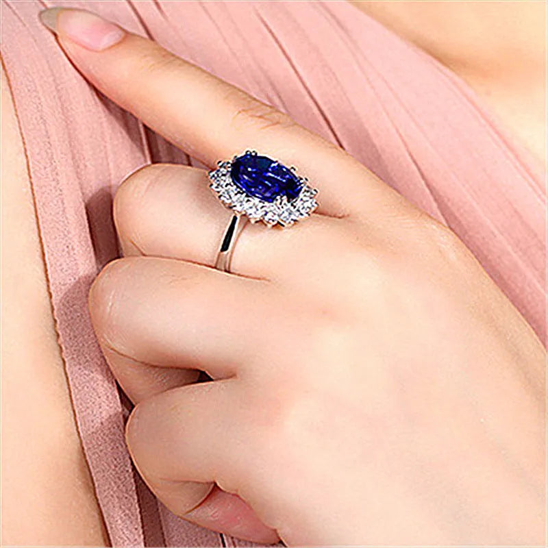 Adjustable opening rhinestone ring in platinum colour with geometric design on white background