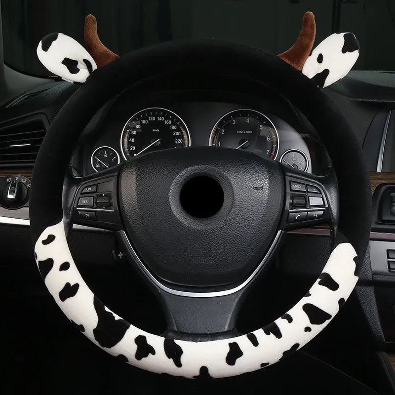 Short plush car steering wheel cover in black colour showing 38cm diameter measurement