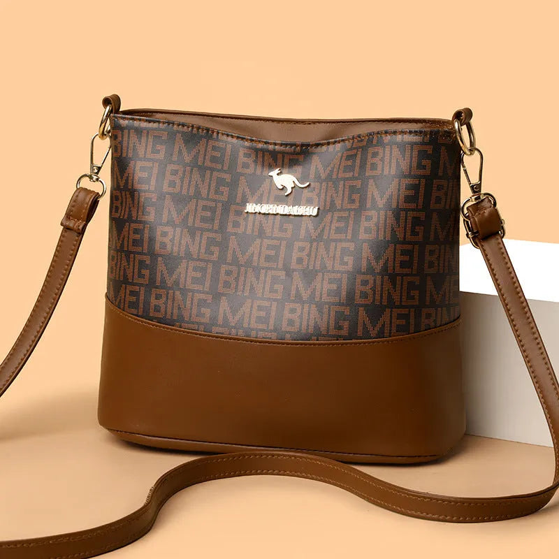 Brown soft leather messenger bag with front pocket and shoulder strap