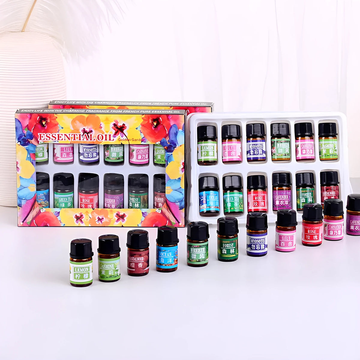 Set of 12 water-soluble humidifier essential oils in 3ML bottles with assorted fragrances including rose, lavender, and lemon