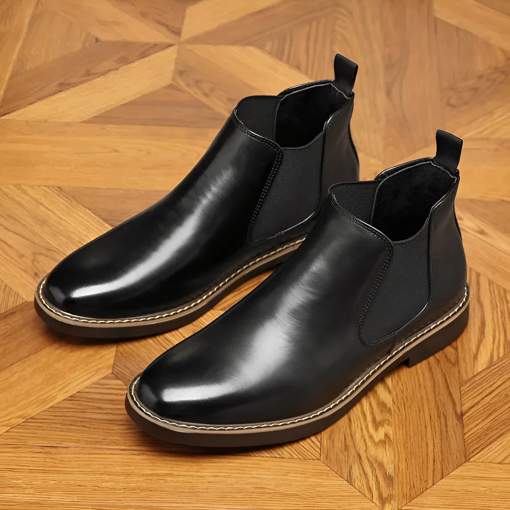 Men's black formal pointed-toe leather boots with a square heel and rubber sole.