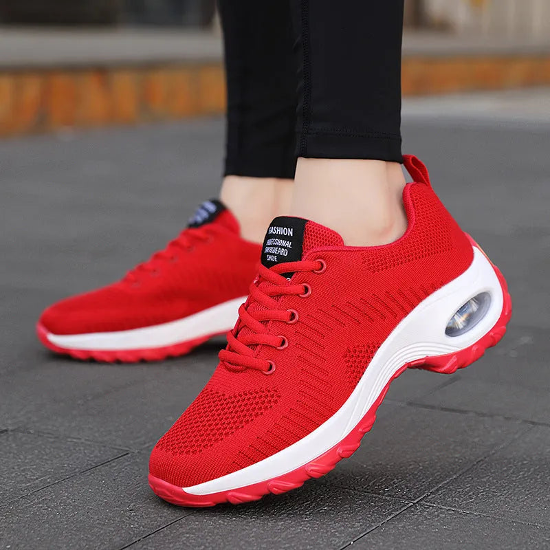 Women's black mesh sneakers with round toe and lace-up design, flat heel and low-top construction