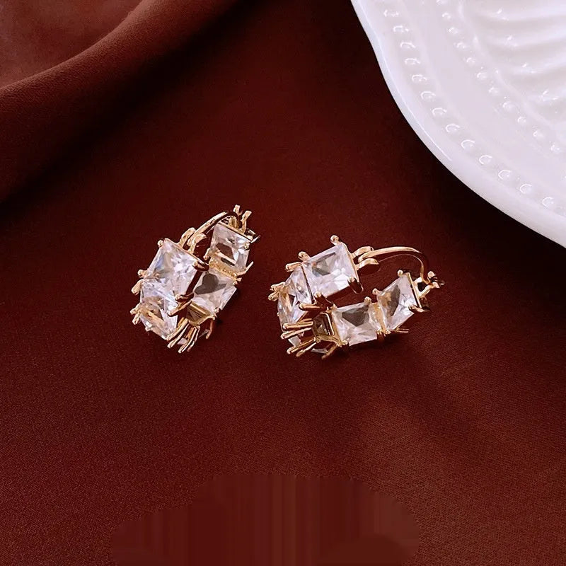 Women's gold-tone copper U-shaped geometric earrings with micro-inlaid zircon