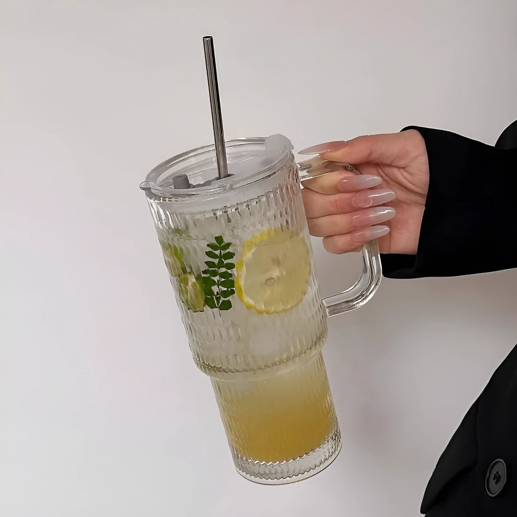 740ml hand-blown glass cup with handle, lid, and curved straw on a table