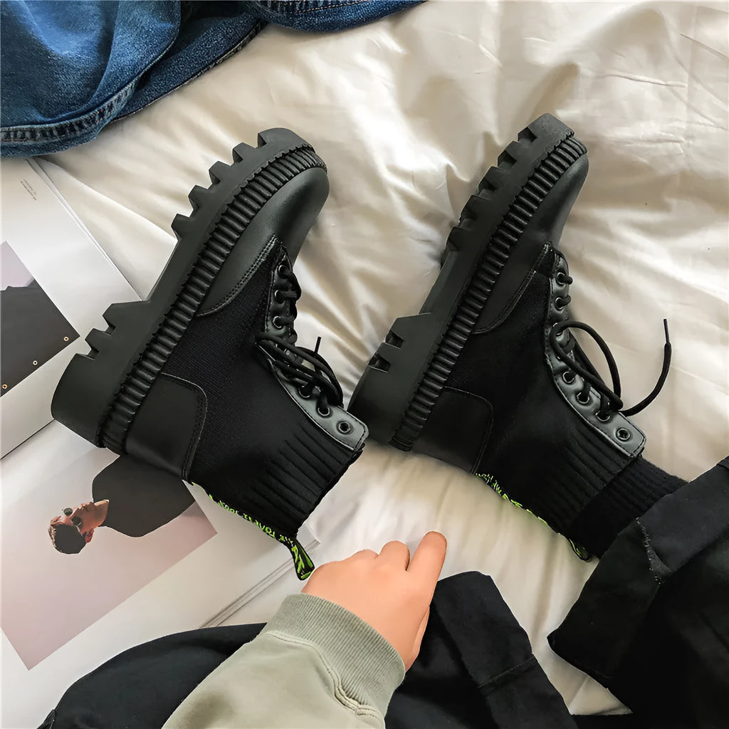 Men's black platform boots with frosted cowhide upper and a side zipper, shown on a size label.
