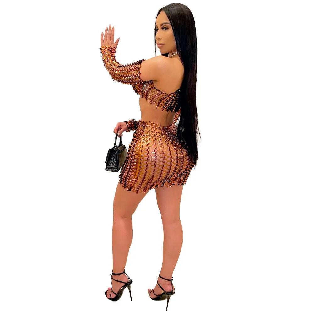 Women's black hollow-out net two-piece dress set with sleeveless top and short skirt on a hanger.