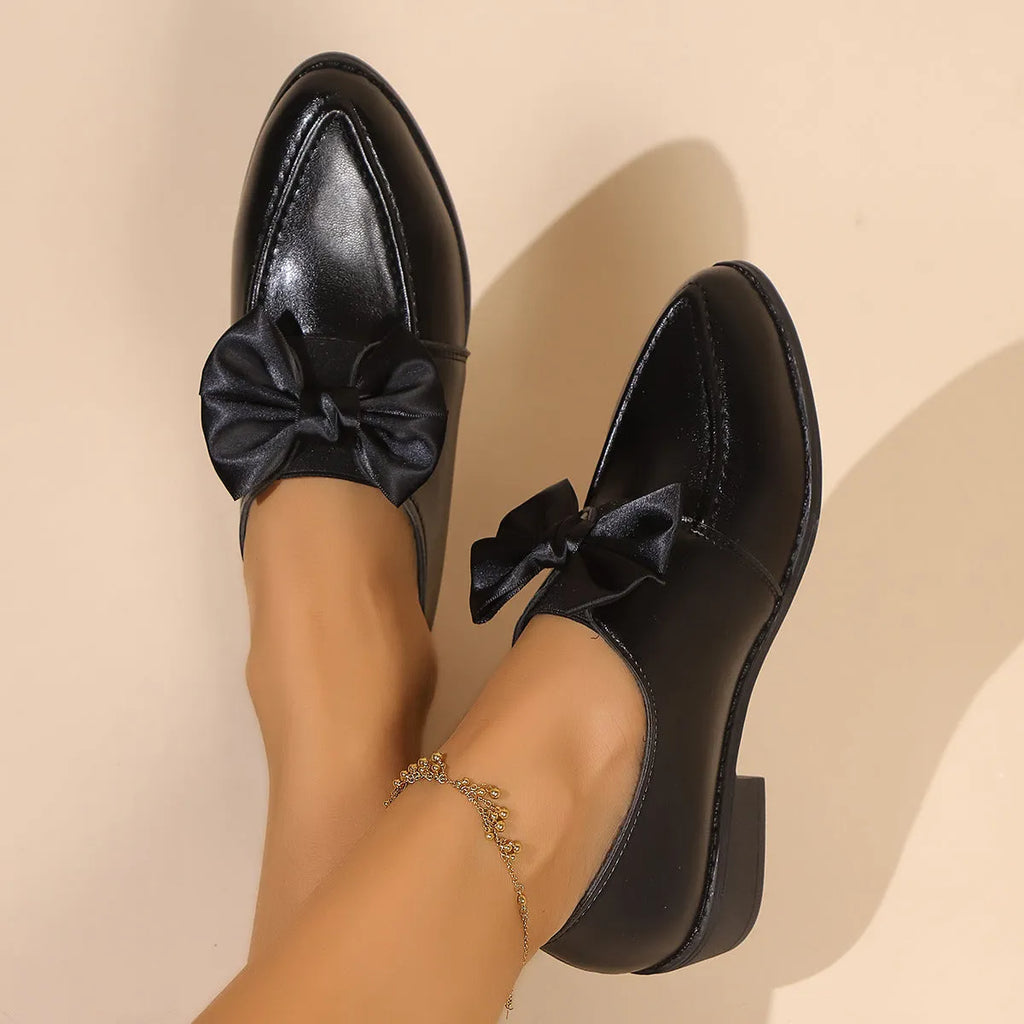Women's British-style leather flats with bow decoration on pointed toe, showing three bow style options