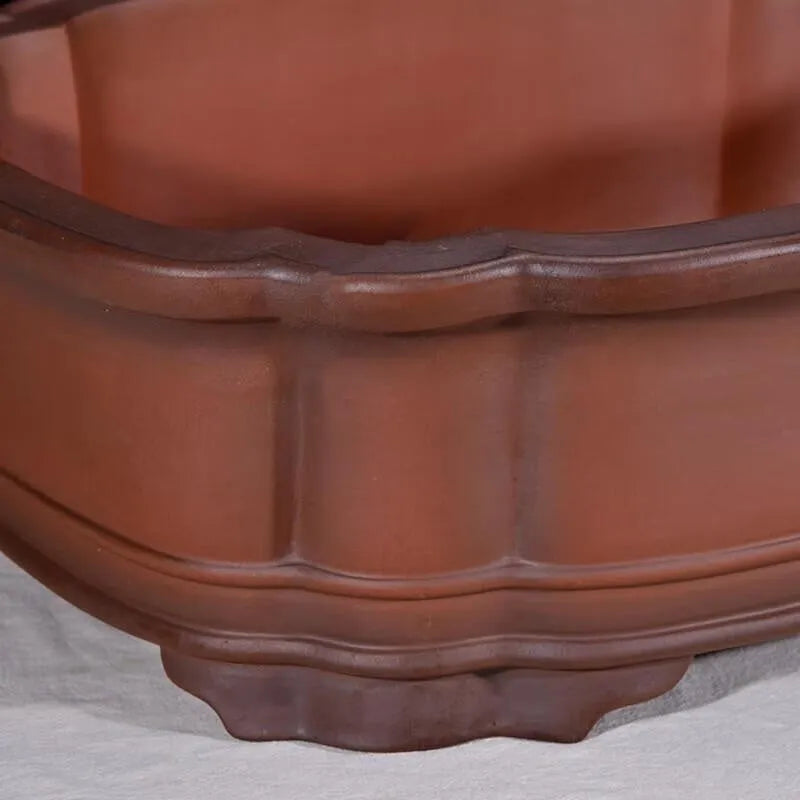 Large Chinese style purple clay flowerpot with antique jade finish and tree stump decoration
