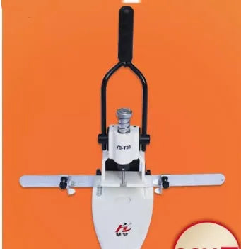 T30 single hole punching machine on desk with paper stack and adjustable pitch guide
